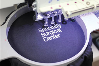 “Specialty Surgical Center” embroidered on clothing