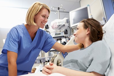 Nurse with great bedside manner talking to a patient